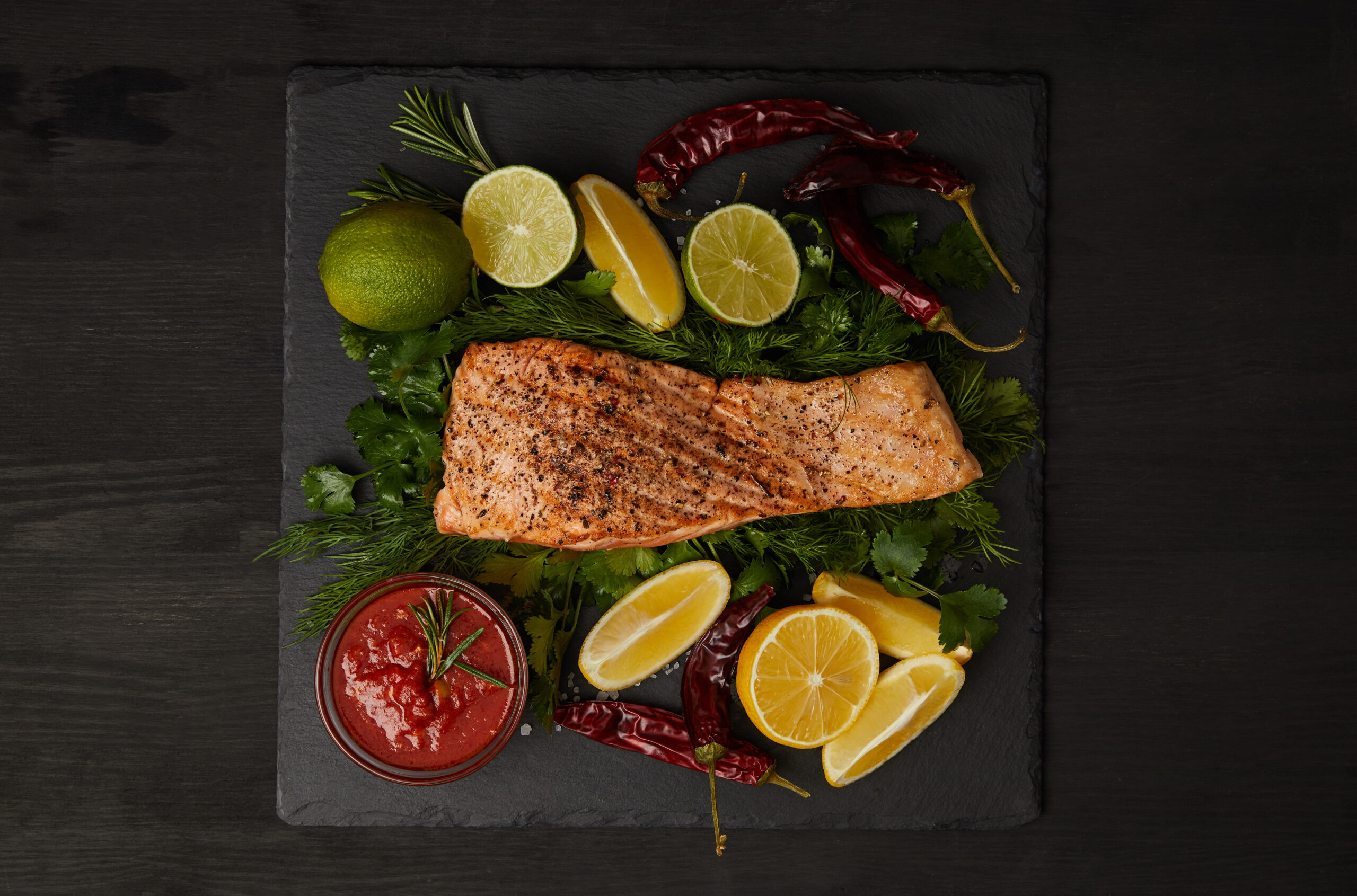 top view of grilled salmon steak pieces of lime a 2024 11 18 06 14 25 utc scaled